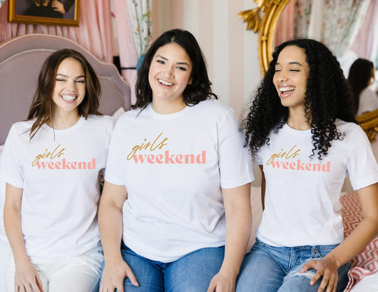 women wearing girls weekend shirts